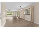 Spacious living room with wood-look flooring and natural light at 10012 Sw 88Th Ct, Ocala, FL 34481