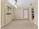 Living room with new flooring and view of the kitchen at 10012 Sw 88Th Ct, Ocala, FL 34481