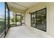 View of enclosed patio with exterior and interior access at 10012 Sw 88Th Ct, Ocala, FL 34481