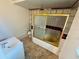 Full bathroom with tiles, white sink, toilet and shower tub with glass blocks and gold trim at 1051 Se 28Th Rd, Ocala, FL 34471