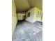 A view of a carport, with a side entrance door and window at 1051 Se 28Th Rd, Ocala, FL 34471