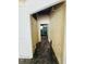 Hallway showing access to unfinished basement and storage with shelving at 1051 Se 28Th Rd, Ocala, FL 34471