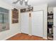 Cozy bedroom featuring laminate floors, a window, and a closet for storage at 10806 Sw 86Th Ave, Ocala, FL 34481