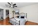 Bright bedroom with hardwood floors, ceiling fan, and access to closet at 10806 Sw 86Th Ave, Ocala, FL 34481
