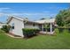Beautiful home exterior featuring a manicured lawn and tasteful landscaping at 10806 Sw 86Th Ave, Ocala, FL 34481
