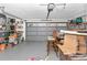 Spacious two-car garage with ample storage shelves and well-lit with overhead lighting at 10806 Sw 86Th Ave, Ocala, FL 34481