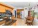 Spacious kitchen with stainless steel appliances, tile backsplash, and a cozy breakfast nook at 10806 Sw 86Th Ave, Ocala, FL 34481