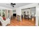 Bright living room with hardwood floors leading into the dining area at 10806 Sw 86Th Ave, Ocala, FL 34481