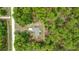 Overhead view of a home nestled among dense greenery, showcasing its peaceful setting at 13131 Sw 73Rd St, Ocala, FL 34481