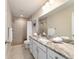 Bathroom featuring a tiled walk-in shower, granite countertops, and great vanity storage space at 13131 Sw 73Rd St, Ocala, FL 34481