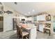 Bright kitchen featuring white cabinets, stainless steel appliances, and a marble island at 13131 Sw 73Rd St, Ocala, FL 34481
