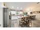 Open concept kitchen with an island with seating and stainless steel appliances at 13131 Sw 73Rd St, Ocala, FL 34481