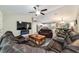 Spacious living room with modern decor including a fireplace, lighting, and large sectional at 13131 Sw 73Rd St, Ocala, FL 34481
