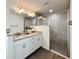Modern bathroom showcases a double sink vanity, granite countertop, and enclosed tiled shower at 1390 Sw Obee Ridge Rd, Dunnellon, FL 34431