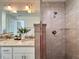 Stylish bathroom features a tiled shower with glass enclosure and a granite countertop vanity at 1390 Sw Obee Ridge Rd, Dunnellon, FL 34431