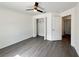 Large bedroom features a ceiling fan, a closet with storage, and a view to another room at 1390 Sw Obee Ridge Rd, Dunnellon, FL 34431