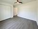 Spacious bedroom with vinyl floors, white walls, and a double door closet at 1390 Sw Obee Ridge Rd, Dunnellon, FL 34431