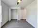 This bedroom has a ceiling fan, closet and vinyl plank floors at 1390 Sw Obee Ridge Rd, Dunnellon, FL 34431