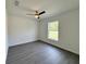 Bright and airy bedroom with a ceiling fan and window offering natural light at 1390 Sw Obee Ridge Rd, Dunnellon, FL 34431
