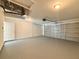 Spacious and bright garage features ample storage space and an automatic door opener at 1390 Sw Obee Ridge Rd, Dunnellon, FL 34431