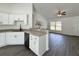 Kitchen view with granite countertops and a view to the open-concept living room at 1390 Sw Obee Ridge Rd, Dunnellon, FL 34431
