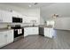 Well-equipped kitchen featuring stainless appliances, granite countertops, and modern finishes at 1390 Sw Obee Ridge Rd, Dunnellon, FL 34431