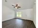 View of bright living area with hardwood floors, ceiling fan, and front door at 1390 Sw Obee Ridge Rd, Dunnellon, FL 34431