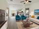 Bright, open living room featuring hardwood floors and a view of the kitchen and dining area at 1390 Sw Obee Ridge Rd, Dunnellon, FL 34431