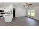 Bright living room with hardwood floors and a sunny window with a view of the property at 1390 Sw Obee Ridge Rd, Dunnellon, FL 34431