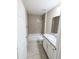 Bathroom featuring a shower over bath combination, a white vanity and tiled flooring at 13921 Sw 108Th Ln, Dunnellon, FL 34432