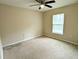 Bedroom boasts neutral carpet, a ceiling fan, and a window for plenty of natural light at 13921 Sw 108Th Ln, Dunnellon, FL 34432