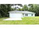 Charming single-story home with a two-car garage, lush lawn, and welcoming curb appeal at 13921 Sw 108Th Ln, Dunnellon, FL 34432