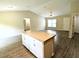 Well-lit living space with an island and new flooring at 13921 Sw 108Th Ln, Dunnellon, FL 34432