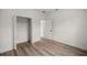 Inviting bedroom with a spacious closet, wood-look flooring, and neutral walls at 142 Guava Pass, Ocklawaha, FL 32179