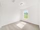 Bright bedroom features neutral carpet, fresh paint, and window with a view at 14690 Sw 24Th. Pl, Ocala, FL 34481