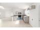 Kitchen view overlooking open floor plan and featuring gray cabinets and counters at 14690 Sw 24Th. Pl, Ocala, FL 34481