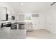 Modern kitchen boasts stainless steel appliances, gray cabinets, and wood-look flooring at 14690 Sw 24Th. Pl, Ocala, FL 34481