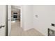 Open concept laundry room with gray tone cabinets and wood look flooring at 14690 Sw 24Th. Pl, Ocala, FL 34481