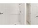Clean and modern tiled shower with shelving and sleek fixtures at 14690 Sw 24Th. Pl, Ocala, FL 34481