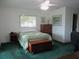 Cozy bedroom featuring a bed, dresser, and a workspace for added functionality at 14695 Sw 112Th Cir, Dunnellon, FL 34432