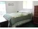 Comfortable bedroom with a view of the outdoors, providing a peaceful retreat at 14695 Sw 112Th Cir, Dunnellon, FL 34432