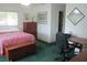 Bedroom features an office area, dresser, and lots of natural light, comfortable and functional at 14695 Sw 112Th Cir, Dunnellon, FL 34432