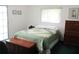 Comfortable bedroom with a view of the outdoors, providing a peaceful retreat at 14695 Sw 112Th Cir, Dunnellon, FL 34432
