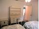 Bright bedroom with a desk, chair, and storage, providing a functional and comfortable space at 14695 Sw 112Th Cir, Dunnellon, FL 34432