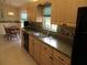 A sunlit dining area complements the kitchen with a breakfast nook and a peaceful ambiance at 14695 Sw 112Th Cir, Dunnellon, FL 34432