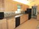 A well-appointed kitchen features modern appliances and a functional layout at 14695 Sw 112Th Cir, Dunnellon, FL 34432