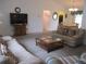 A spacious carpeted living room features abundant natural light and neutral décor at 14695 Sw 112Th Cir, Dunnellon, FL 34432