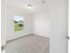 Bright bedroom features neutral carpet, natural light and neutral paint at 14698 Sw 20Th Pl, Ocala, FL 34481