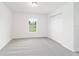 Bedroom features neutral carpeting, closet and window at 14893 Sw 23Rd Pl, Ocala, FL 34481