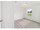 This bedroom features neutral carpeting and a window for natural light at 14893 Sw 23Rd Pl, Ocala, FL 34481